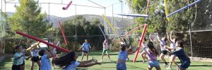 Campers playing with pool noodles