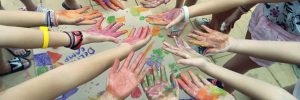 Camper's hands with paint on them